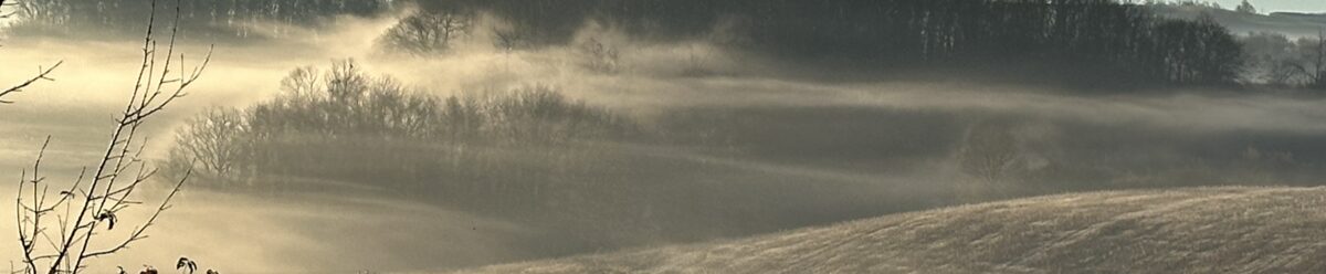 Morning mist rolling over the Gers hills at dawn